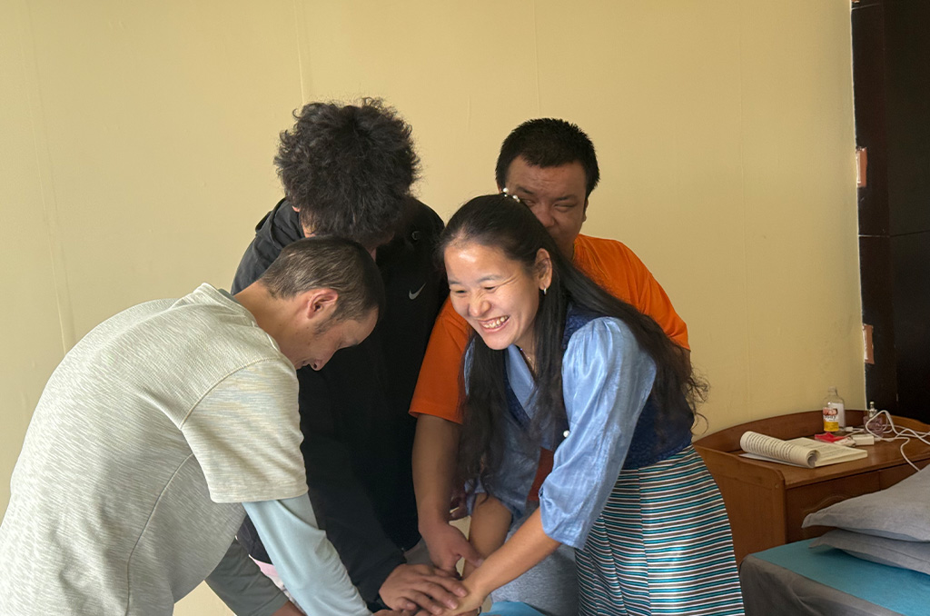 Chungla with her staffs